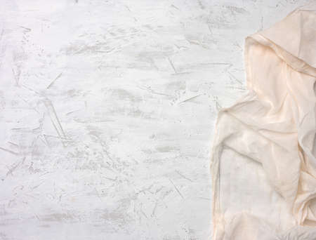 white textile kitchen napkin on gray cement background, copy spaceの写真素材