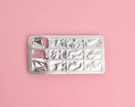 blister pack of capsule pills on a pink background, top viewの写真素材