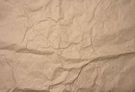 crumpled blank sheet of brown wrapping kraft paper, vintage texture for the designer, full frame