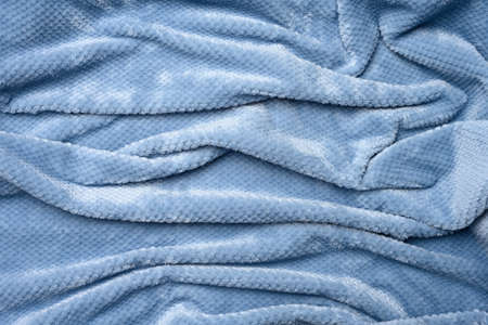gray-blue plush fabric, wrinkled canvas, close upの写真素材