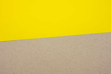 gray-yellow cardboard paper background, copy space, close upの写真素材