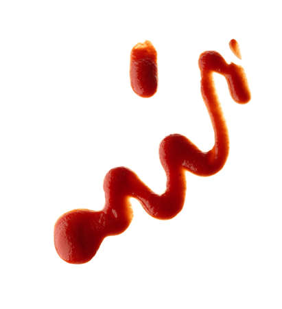 spilled red tomato sauce on white isolated background, ketchup, top viewの写真素材