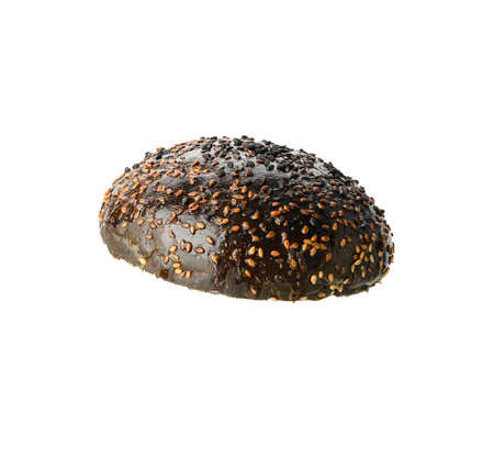 top half of baked black round sesame bun for hamburger, food isolated on white backgroundの写真素材