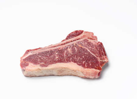 fresh raw piece of beef meat, striploin steakon white background, top view. Marbled piece of meat New Yorkの写真素材