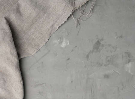 linen kitchen gray towel on gray cement background, copy space, top viewの写真素材