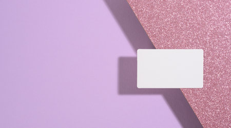 blank rectangular business card lies on a modern purple background sheets of paper with a shadow. Business template, flat layの写真素材