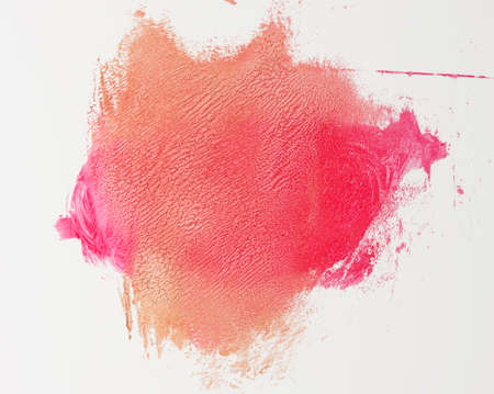 sample of red smeared lipstick on white backgroundの写真素材