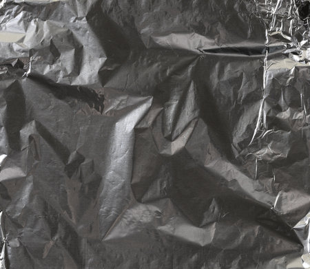 crumpled gray foil sheet for food packaging, full frameの写真素材