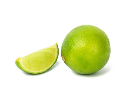 Lime with slice isolated on white background, close up