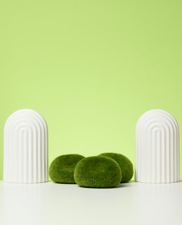 podium with moss and arches to showcase cosmetics, products and other goods. Green background