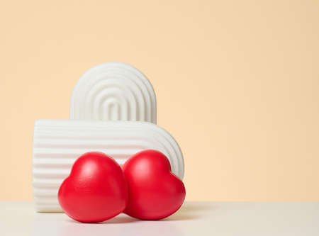 two red hearts on brown backgroundの写真素材