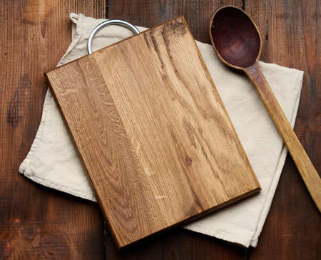 empty rectangular wooden cutting kitchen board on table, top view, copy space