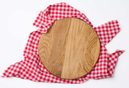 empty round wooden cutting kitchen board on a white background, pizza board, copy spaceの写真素材