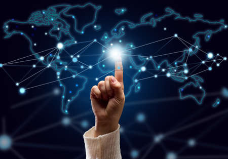 female hand presses on the connection point and holographic global network with connections....