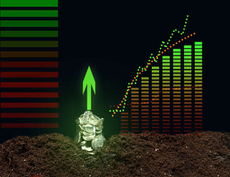 a can of coins on the ground and a growing graph of indicators. performance growth conceptの写真素材