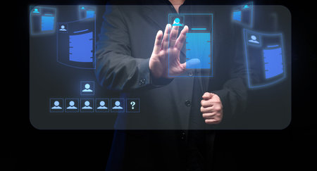 businessman stands around a holographic screen with virtual resume. Selection of a candidate, search for a talented employee. career growthの写真素材