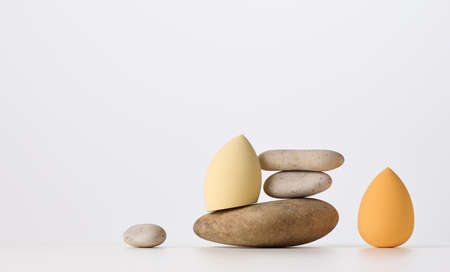oval sponges for applying makeup on a white background. beauty itemsの写真素材