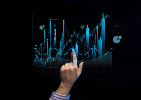 holographic graph with growing indicators and a woman's hand. Business growth concept, profitable startup, profitable business strategy, sales increase. High performanceの写真素材