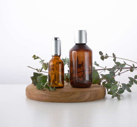 Brown glass bottle for cosmetic liquid products on white background. Template for cosmetics, advertising and promotionの写真素材