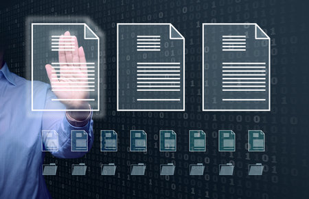 female hand checks documents on a holographic screen. The concept of compliance control