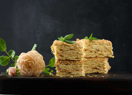 A stack of baked Napoleon pie slices with cream. Puff pastry, delicious dessertの写真素材