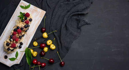 Baked cake made from whipped chicken protein and cream, decorated with fresh berries. Dessert Pavlovaの写真素材