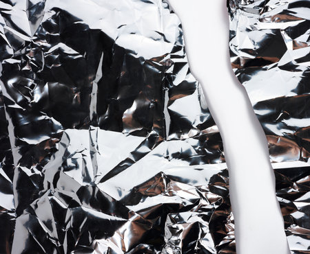 Crumpled gray foil sheet for food packaging, full frameの写真素材