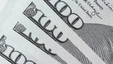 Fragment of paper hundred dollar bills, close up