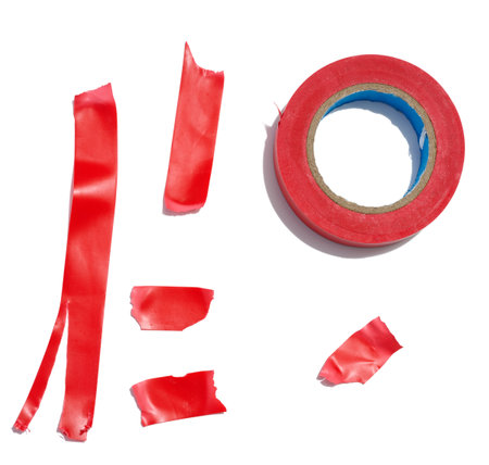 Various pieces of red duct tape and a roll of duct tape on a white isolated background, a repair itemの写真素材