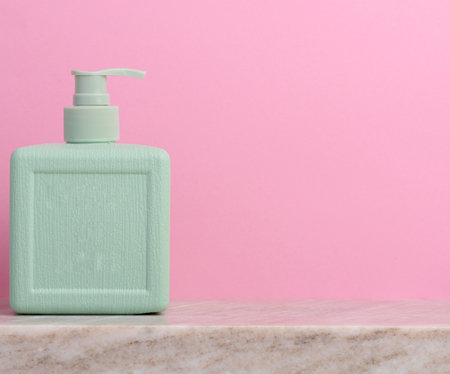 Plastic soap dispenser container on a pink background, cosmeticsの写真素材