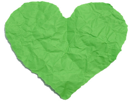 A heart cut out of green paper on a white isolated background, an element for a designerの写真素材