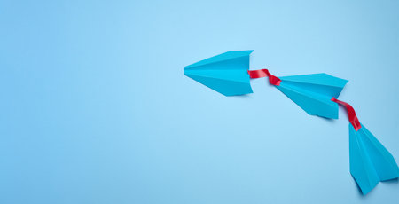 A group of blue airplanes follows each other, a concept of mass influence and manipulation, Top view, copy spaceの写真素材