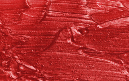 Sample of red glitter gel with small particles, texture of highlighter cosmetics, lipstick, blushの写真素材