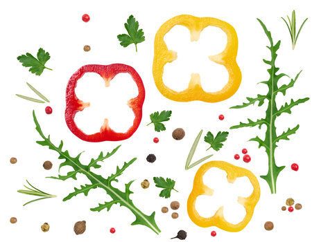 Green arugula leaf, pepper slices, rosemary leaves and dry red and black pepper fruits on a white isolated background, salad ingredientsの写真素材