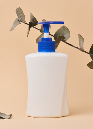 White plastic container with a pump for liquid products. Container for cosmetics, soap, creamの写真素材