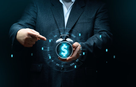 Businessman holding an alarm clock, the concept of time is money, the speed of decision makingの写真素材