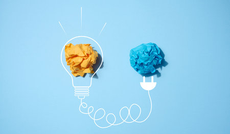 The concept of inspiration with new ideas, the search for creative solutions, crumpled sheets of...