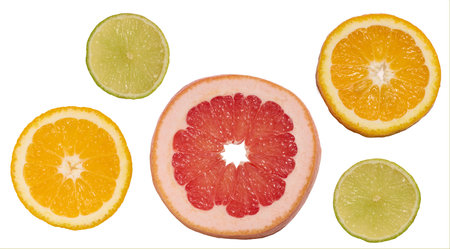 Sliced pieces of orange, lime and grapefruit on a white background, top viewの写真素材