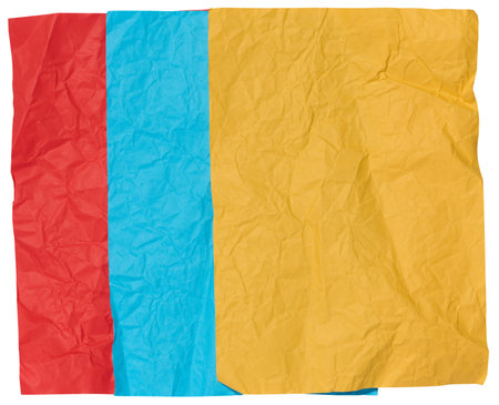Yellow, blue and red crumpled sheets of paper on a white backgroundの写真素材