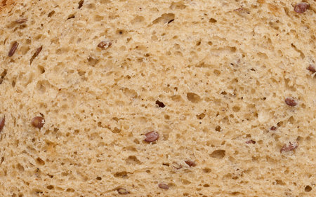 Texture of whole grain bread with seeds, full frame