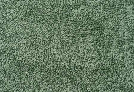 Texture of a green terry cotton towel, canvas. Macroの写真素材