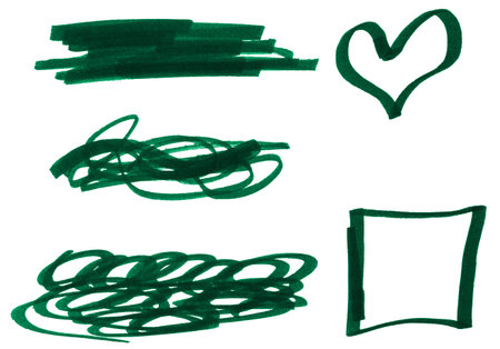 Various shapes and doodles drawn with a green marker on a white isolated backgroundの写真素材