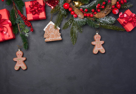 Christmas decor, gift red boxes on a black background, top view. Place for description