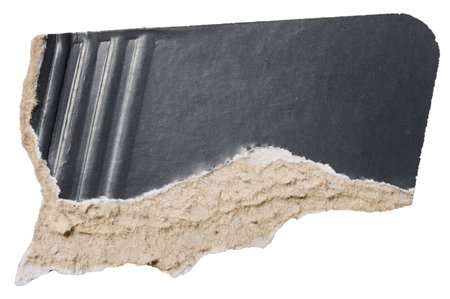 Piece of black cardboard with torn edges on isolated backgroundの写真素材