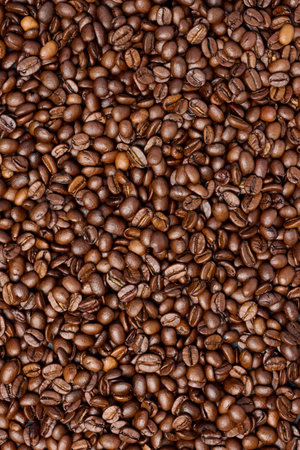 Scattered roasted coffee beans, full frameの写真素材