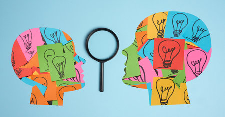 Silhouette of a human head and stickers with drawn electric lamps on a blue background, search for...