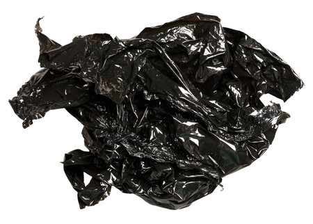 Crumpled piece of black polyethylene on isolated backgroundの写真素材
