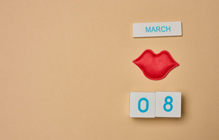 Textile red lips and cubes with the inscription March 8th, International Women's Day. View from aboveの写真素材