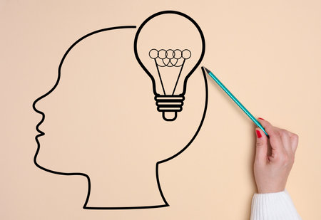 Silhouette of a human head and an electric lamp, concept of searching for creative ideasの写真素材