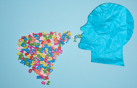 Silhouette of a human head and wooden letters, speechの写真素材